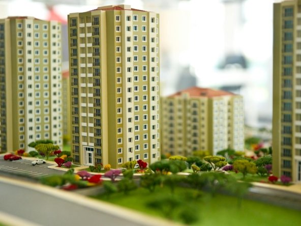 Close-up image of a modern residential building model, showcasing urban architecture.
